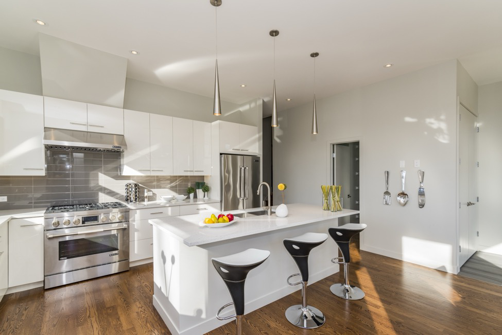 A large kitchen with luxury vinyl flooring.