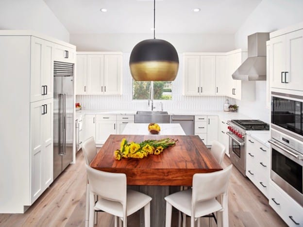 Wood texture waterproof flooring in a modern Tampa kitchen, featuring white Wellborn cabinets.