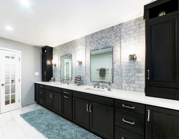 Dark-colored Wellborn cabinets paired with waterproof tile flooring for a modern Tampa bathroom.