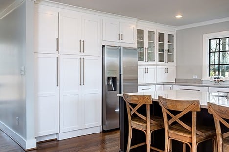 Warm and functional kitchen flooring paired with Wellborn cabinet options suitable for Tampa homes.