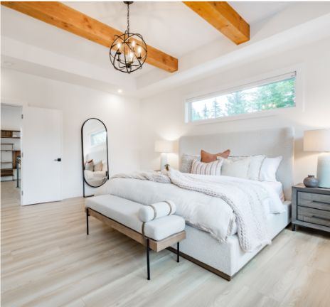 Romantic flooring styles Tampa homes featuring luxury wood-look flooring in a modern bedroom
