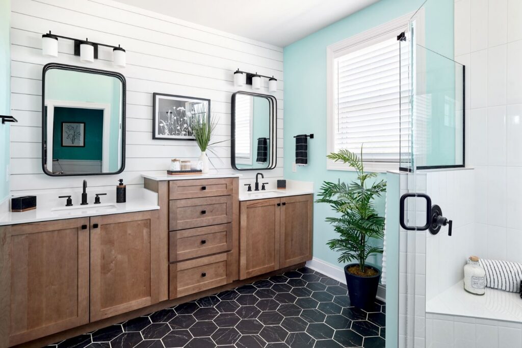 Black hexagon tiles in a modern country-style bathroom.
